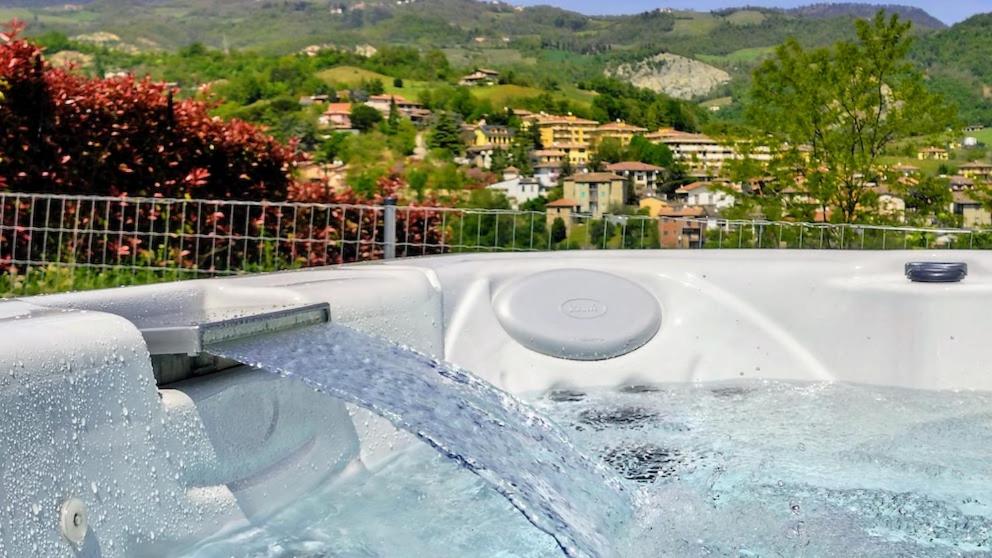 a hot tub with water coming out of it at Bobbio Relax in Bobbio