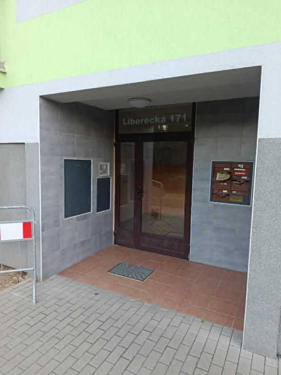 an entrance to a building with a glass door at Apartmán Zdislava in Česká Ves