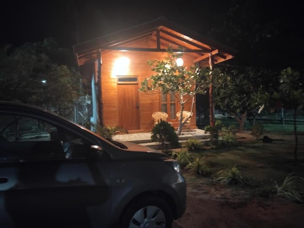 a car parked in front of a house at night at Nesan’s villa in Trincomalee