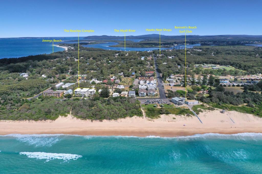 an aerial view of a resort on a beach at Bennetts by the Beach in Hawks Nest