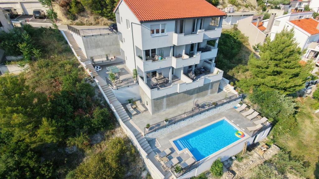 an aerial view of a house with a swimming pool at Villa Stanić in Omiš