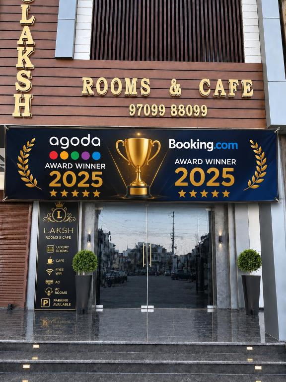 a sign for a roos and cafe with a trophy at Laksh hotel,Proprietor Dilbag in Kurukshetra