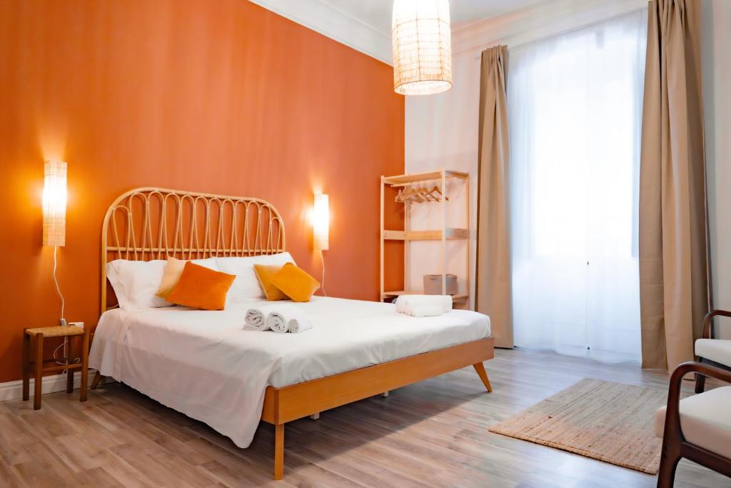a bedroom with a bed with two stuffed animals on it at Inderooms Carloforte in Carloforte