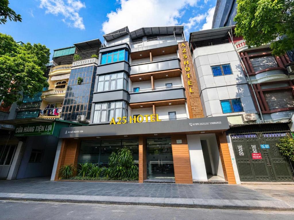 an apartment building with an aindersforce sign on it at A25 Premium Hotel - 21 Nghia Tan in Hanoi