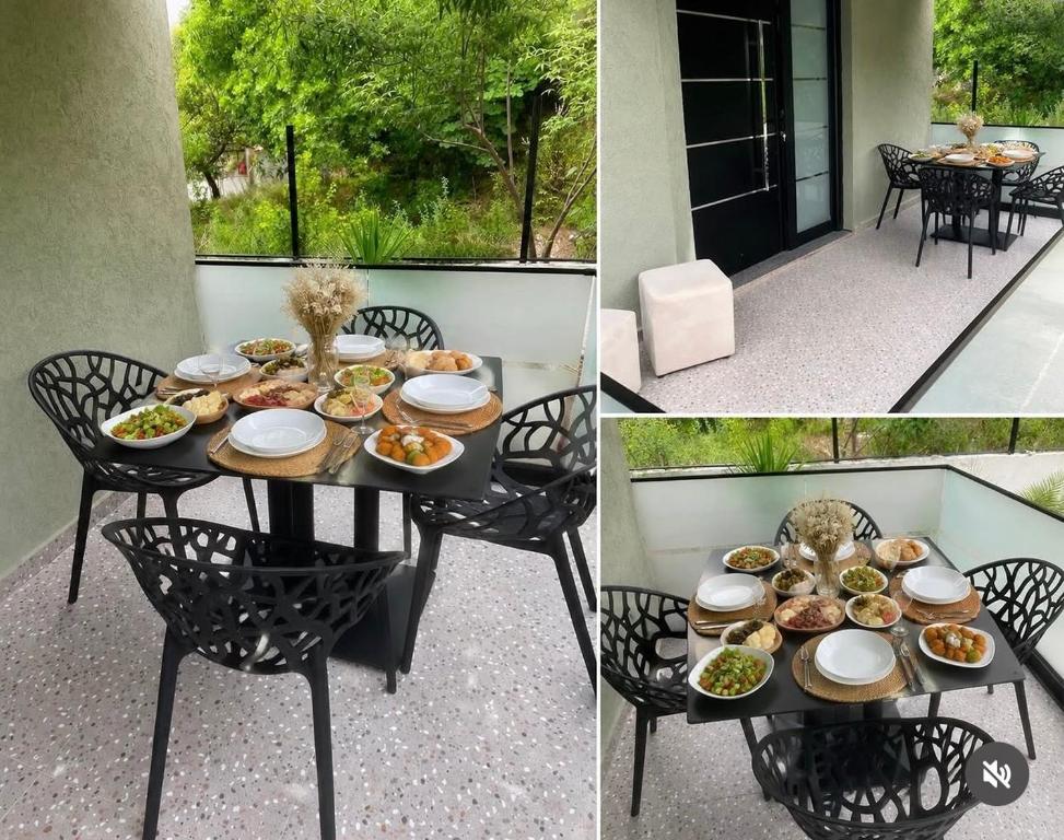 a table with plates of food on a patio at Melody's Room in Borsh