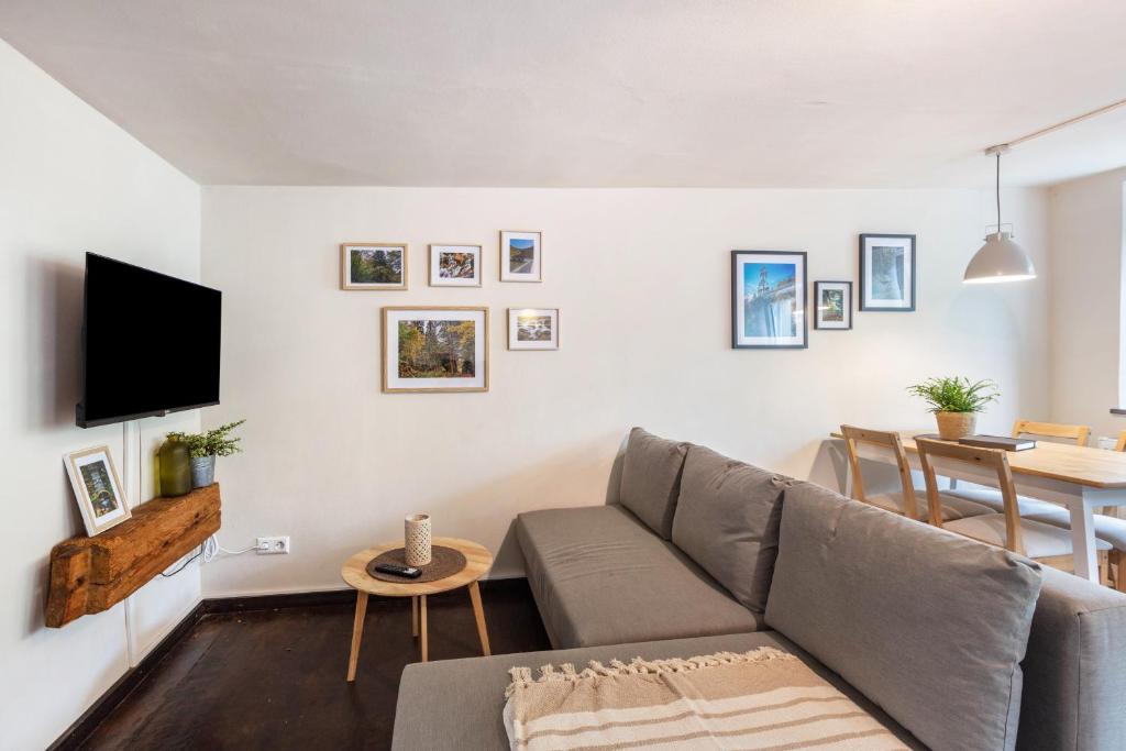 a living room with a couch and a table at Ferienwohnung am Eichhölzle in Wehr