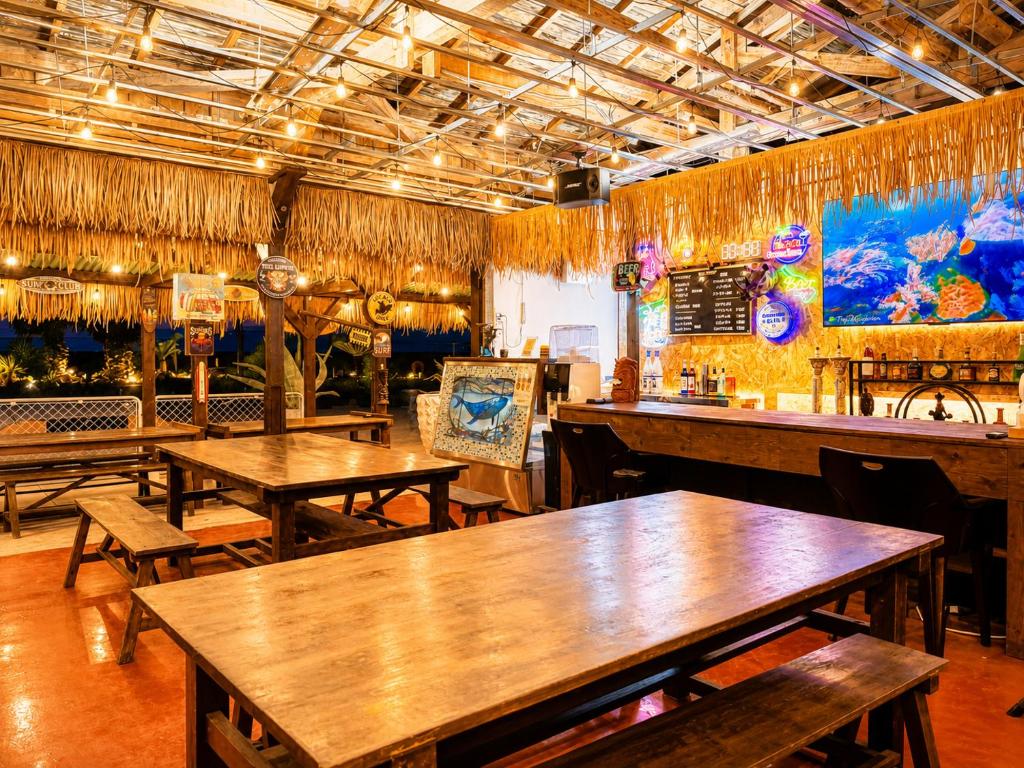 a restaurant with tables and chairs in a room at 江田島BASE in Okimi in Etajima