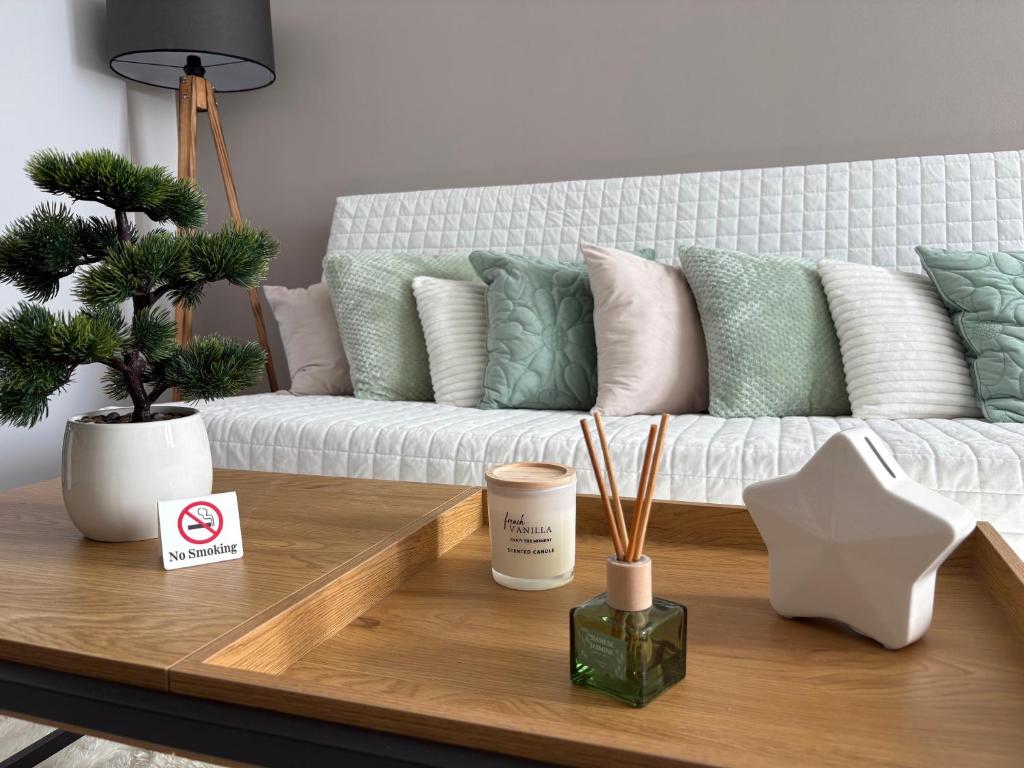 a living room with a couch and a coffee table at PlatanHome 12 in Lenti
