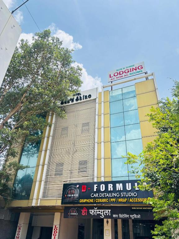 a front view of a building with a for thumb sign at Sun N Shine in Pune