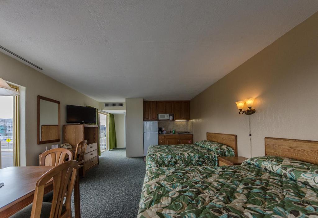 Postel nebo postele na pokoji v ubytování Attache Motel