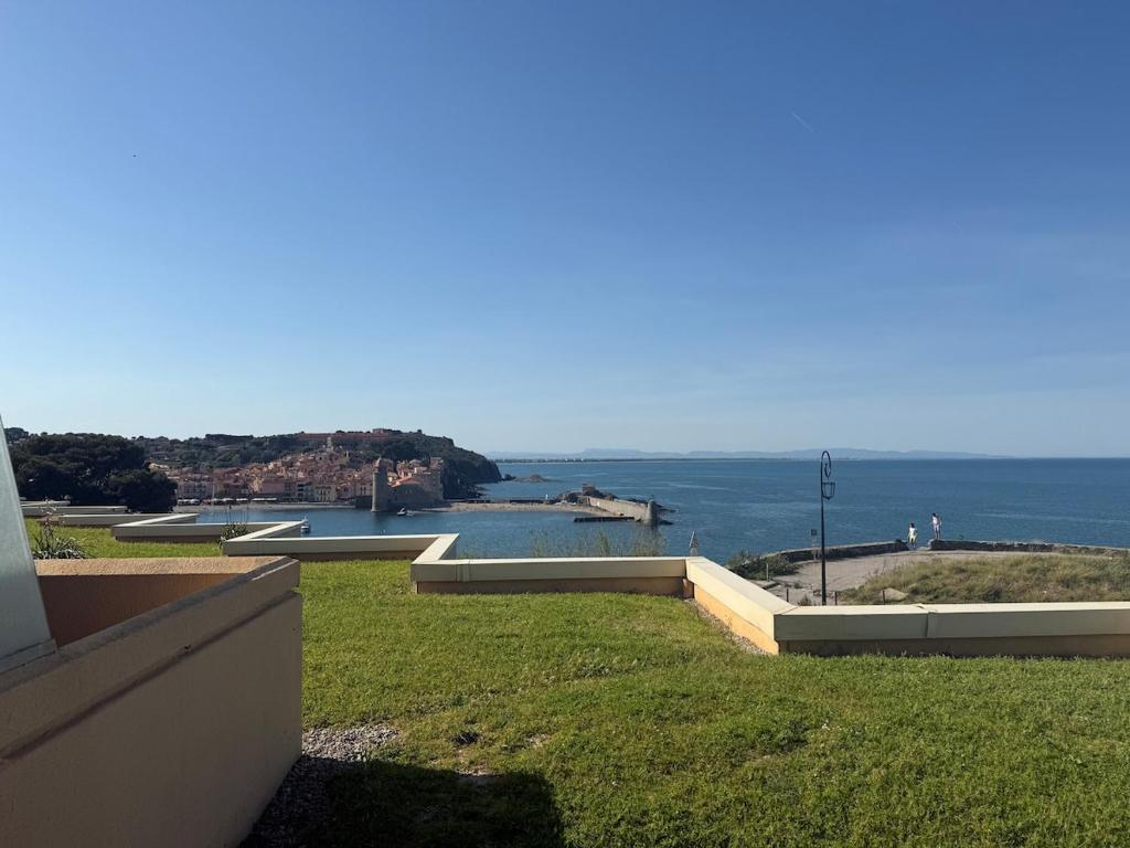 a view of a body of water from a building at La Mirande in Collioure
