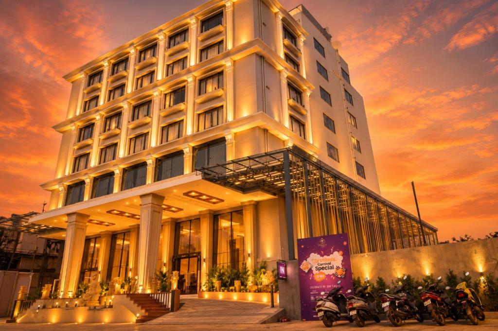 a building with motorcycles parked in front of it at Hotel Accord Premier in Raigarh