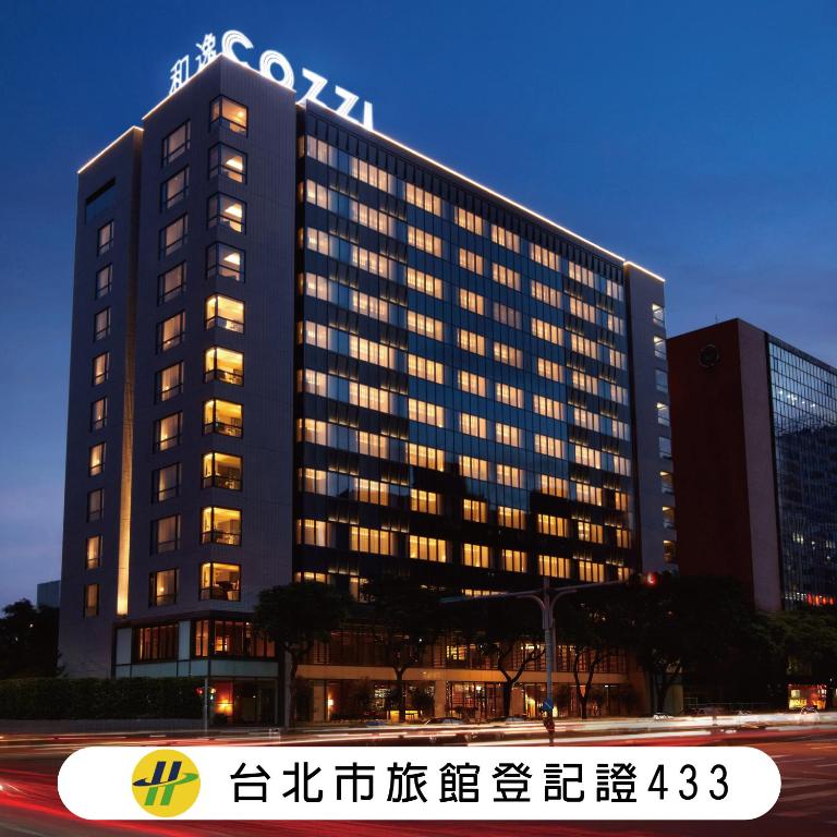 a building with a sign on top of it at Hotel COZZI Minsheng Taipei in Taipei