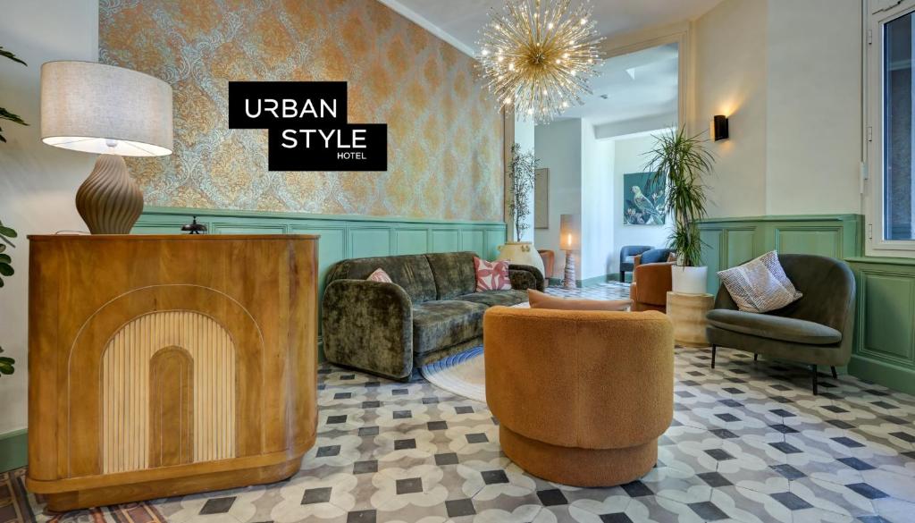 a living room with a couch and a fireplace at Urban Style Hotel Blason du Ventoux in Carpentras