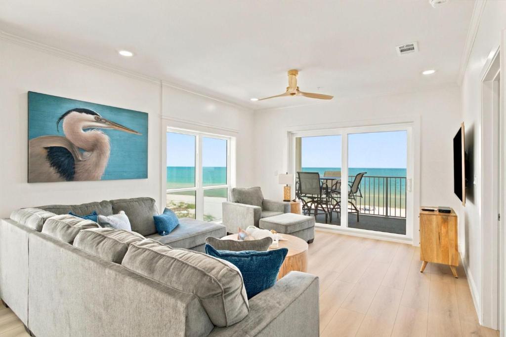 a living room with a couch and a table at Riviera Dunes 501 in Perdido Key