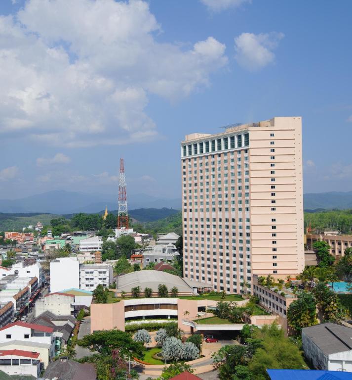 a view of a city with a tall building at Grand Mandarin Betong Hotel in Betong