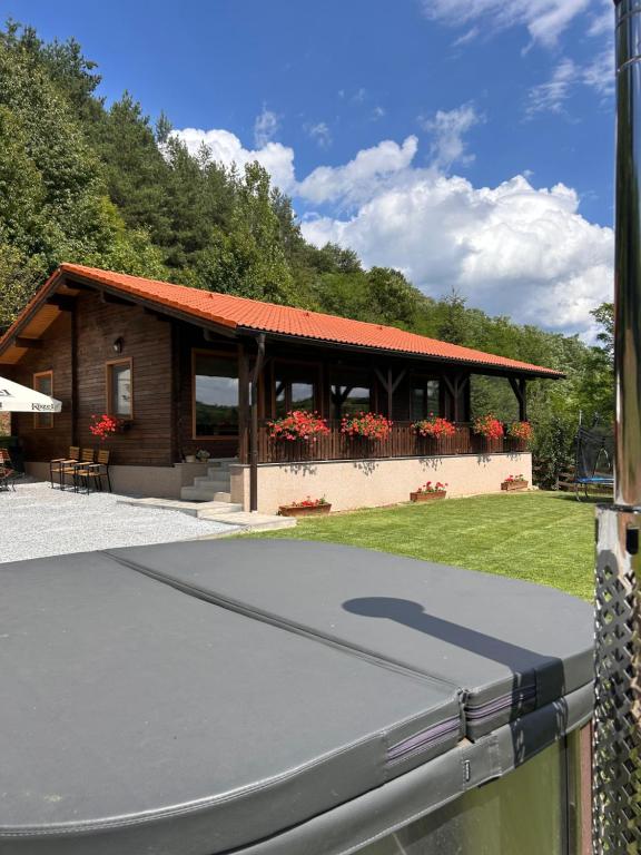 a building with a roof with a ramp in front of it at Panorama House in Praid