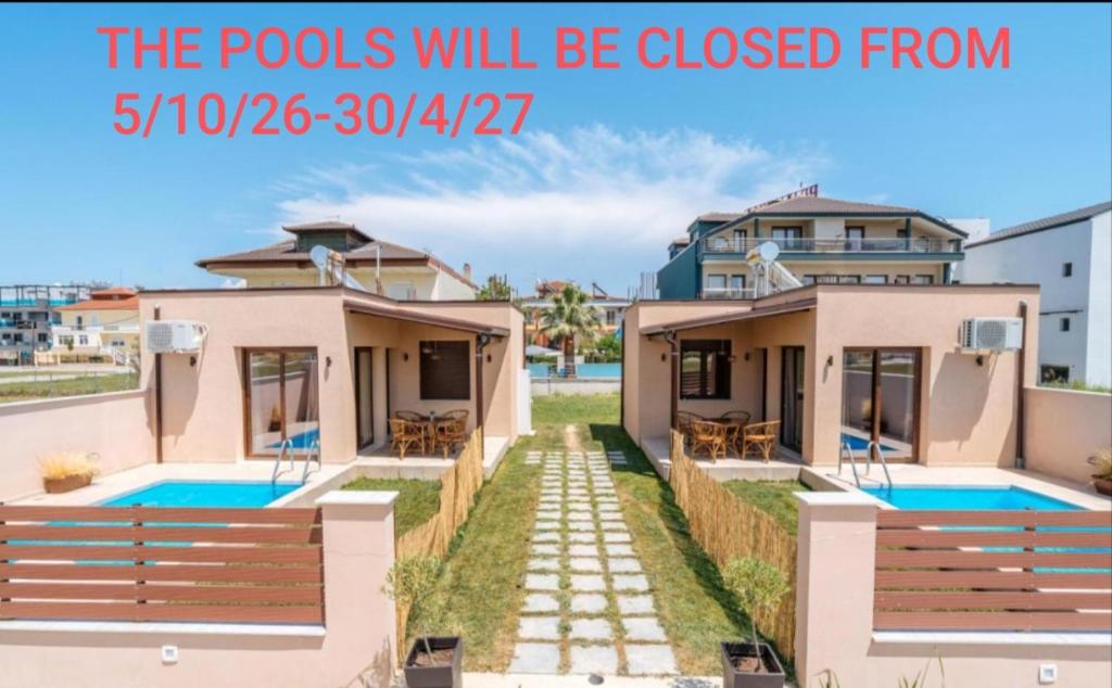 a villa with a pool in front of it at SALVE holiday houses in Paralia Katerinis