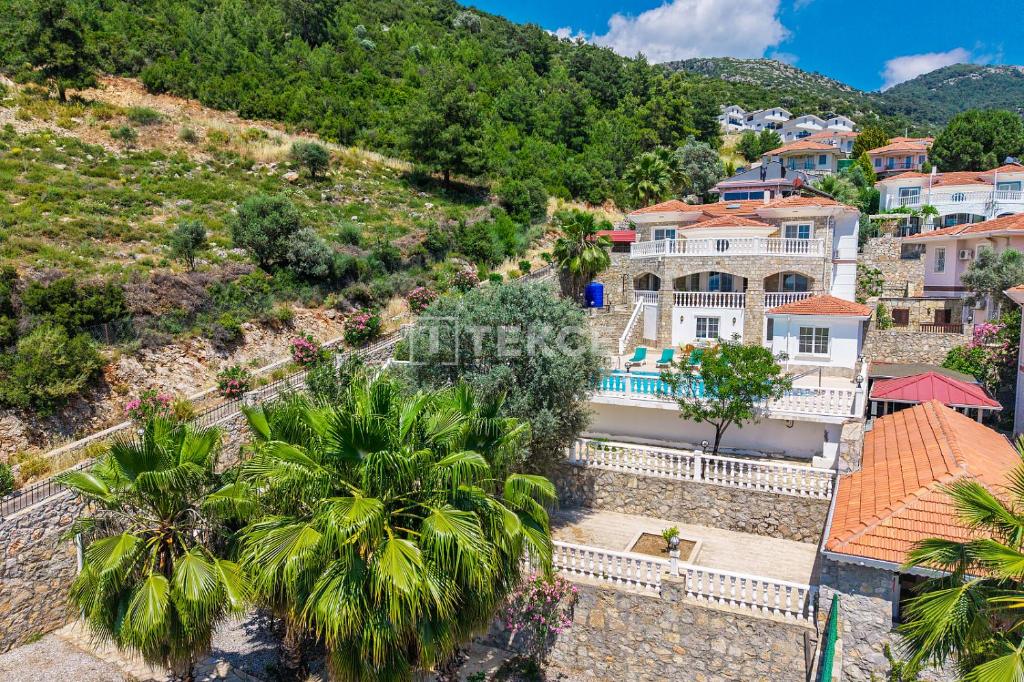 an aerial view of a village with houses and palm trees at TEKCE Yeşilüzümlü Villa No 17 in Uzumlu