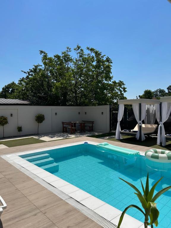 a swimming pool in the backyard of a house at La Mirage in Šabac