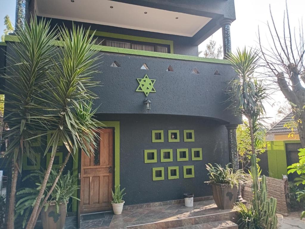 a house with a star on the side of it at Afro Rasta Kumusha in Germiston