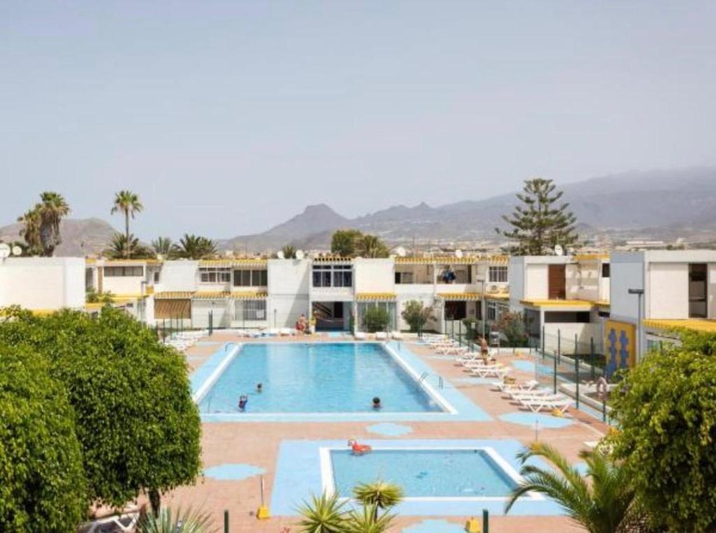 a view of the pool at a resort at Rentdragoana in Costa Del Silencio