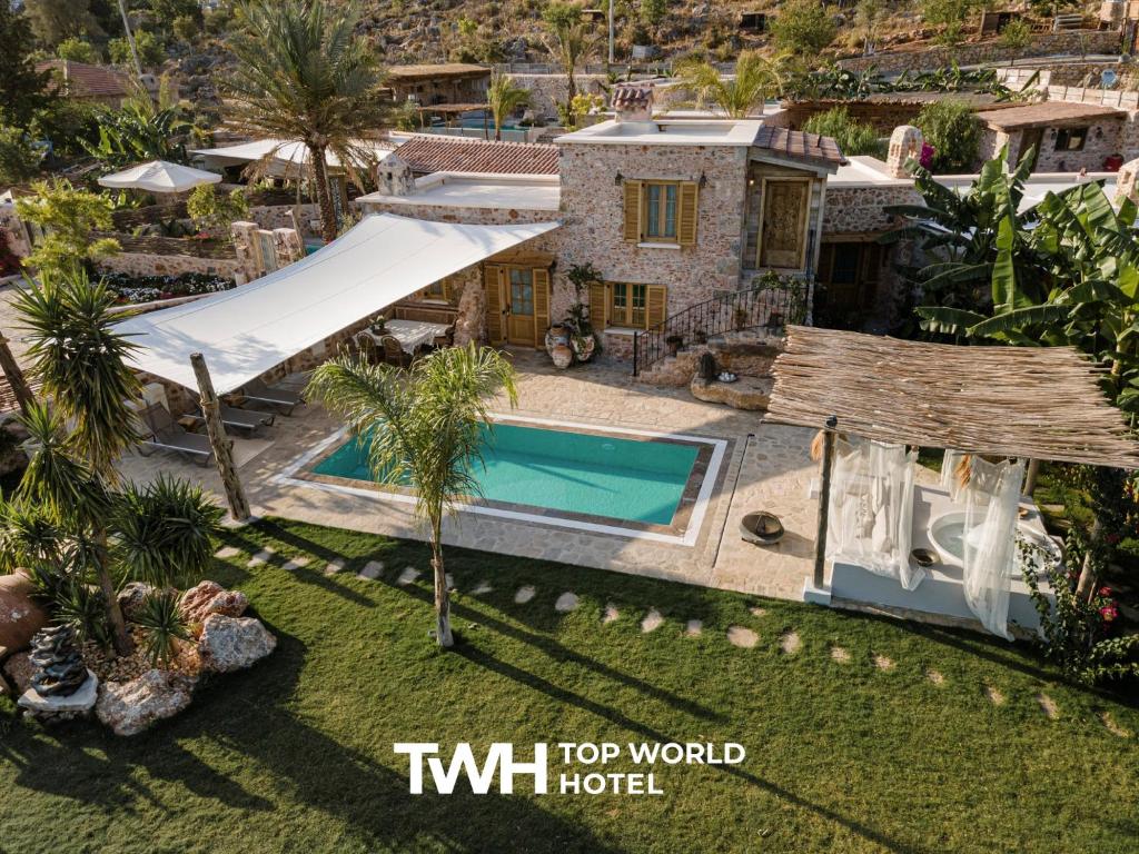 an aerial view of a house with a swimming pool at Kassandra Heritage in Oludeniz