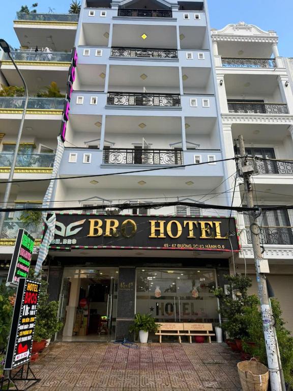 a building with a hotel sign in front of it at Hotel Bros in Ho Chi Minh City