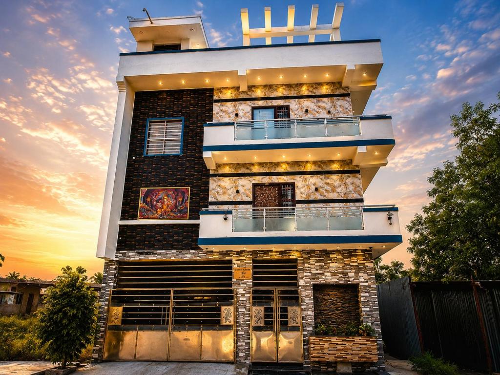 a building with a balcony on the side of it at CG Blue Horizon Villa in Vellore