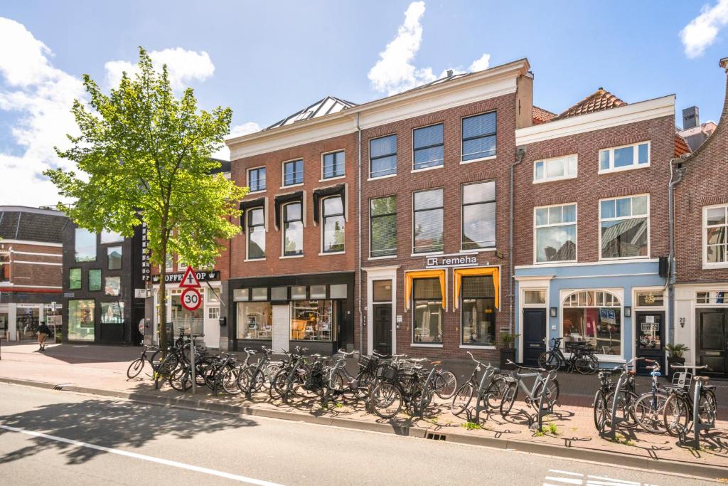 a group of bikes parked in front of a building at Five Churches View apartments in Haarlem