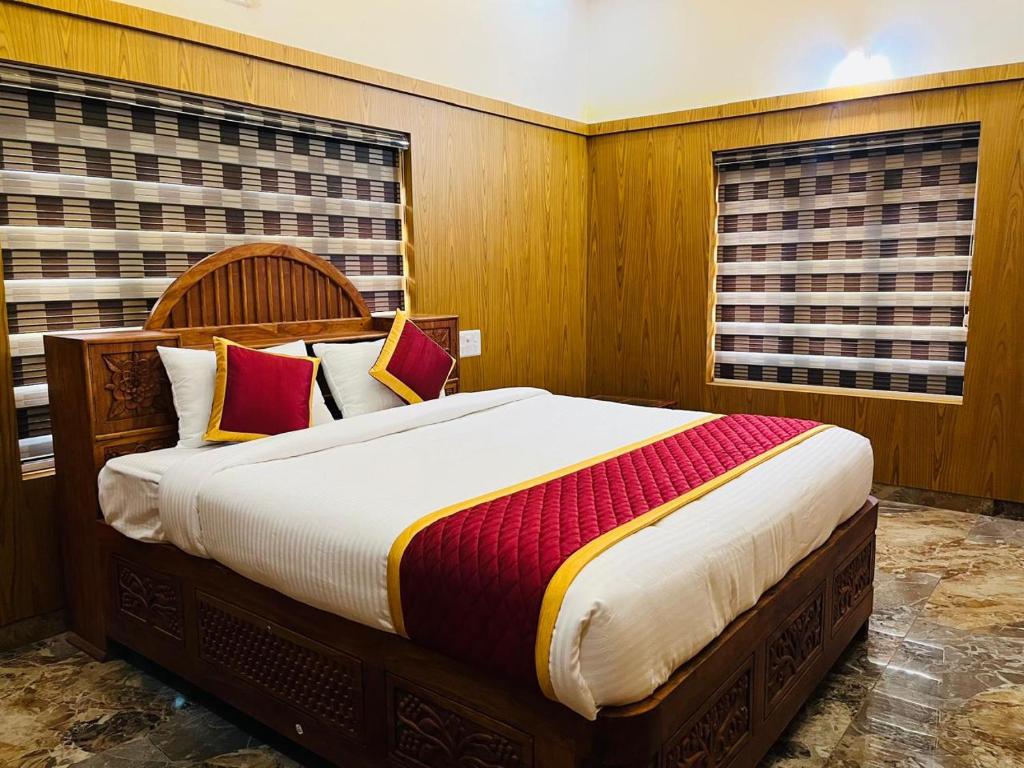 a bedroom with a large bed in a room at Coffeehut Pool Villa in Pinangode