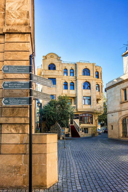 a street sign in front of a building at The Destan Hotel and Terrace in Baku