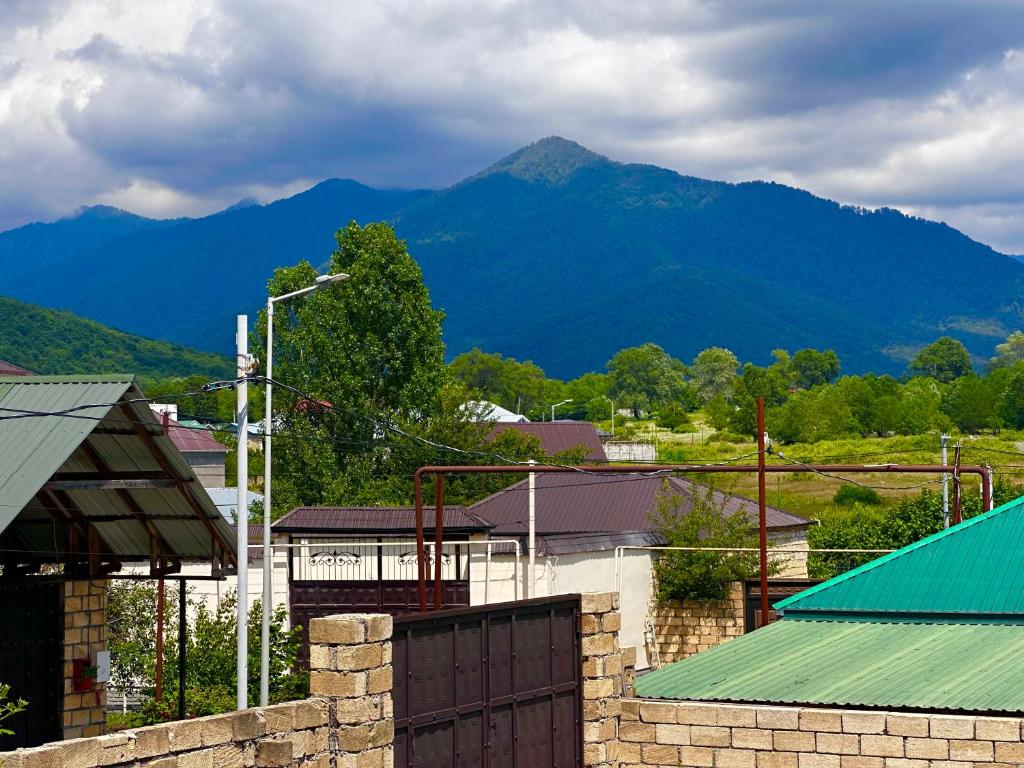 a view of a town with mountains in the background at Peaceful Garden Villa in Gabala