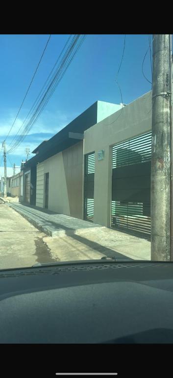 a view from a car of a building on a street at Residencial Beatriz centro in Formosa