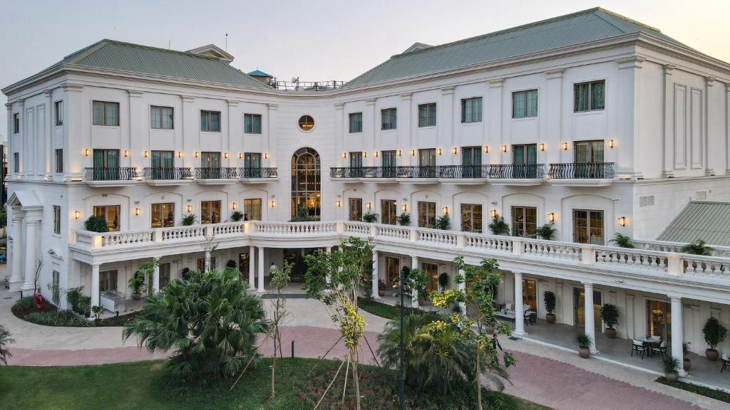 an aerial view of a large white building at DLF Club 4 in Gurgaon