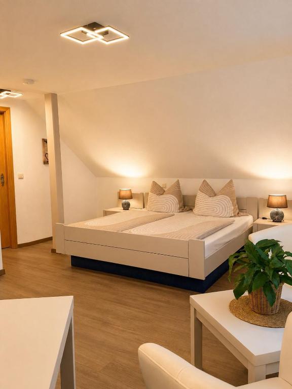 a bedroom with a large white bed in a room at MiTi Sleep and Go in Bernkastel-Kues