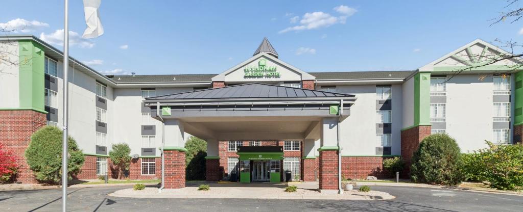 a hotel with a sign on the front of it at Wyndham Garden Madison Fitchburg in Madison