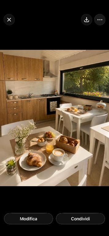 a kitchen with a table with food on it at Altea in Taurianova