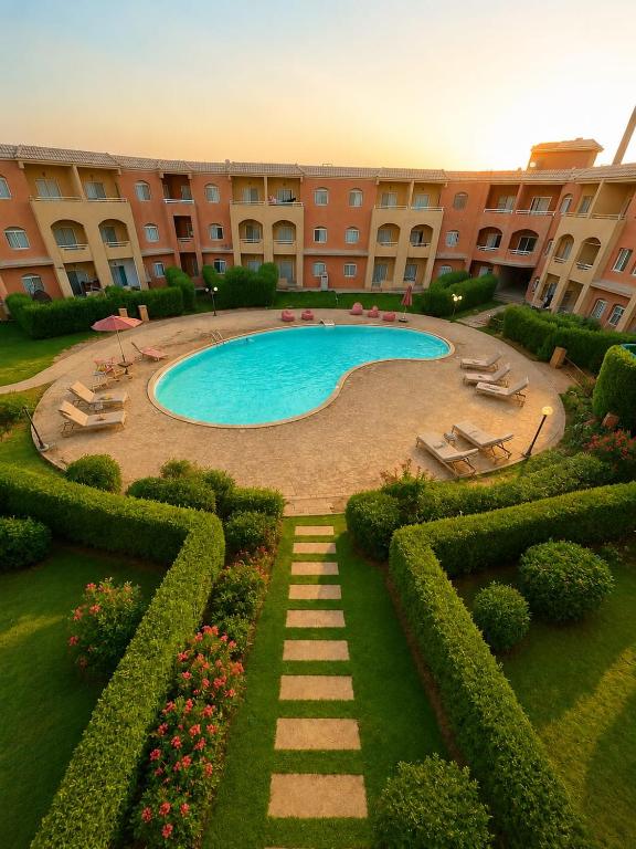 a swimming pool in the middle of a building at El wadi Pearl Residence in Ain Sokhna