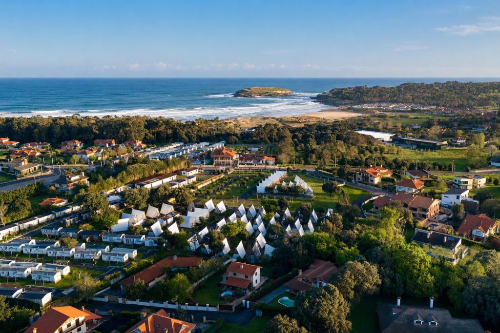 an aerial view of a town next to the ocean at Kampaoh Somo Playa in Somo