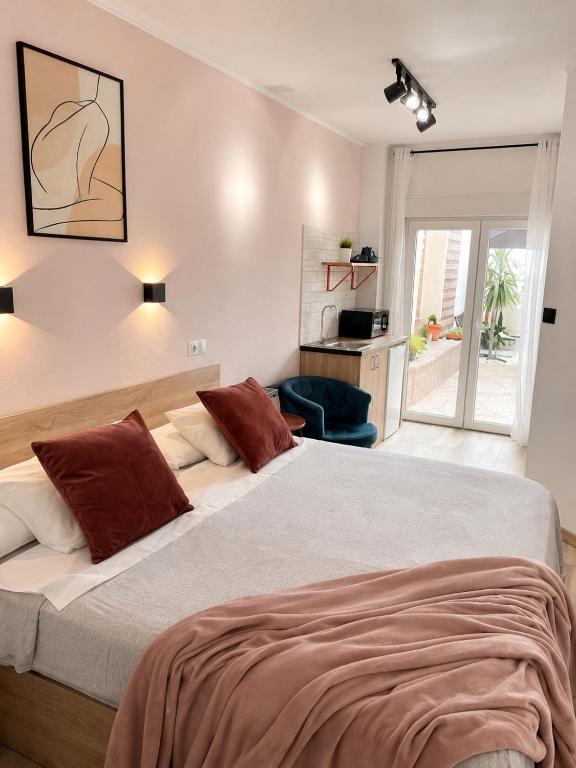 a bedroom with a large bed with red pillows at Casa Durán Alicante in Alicante