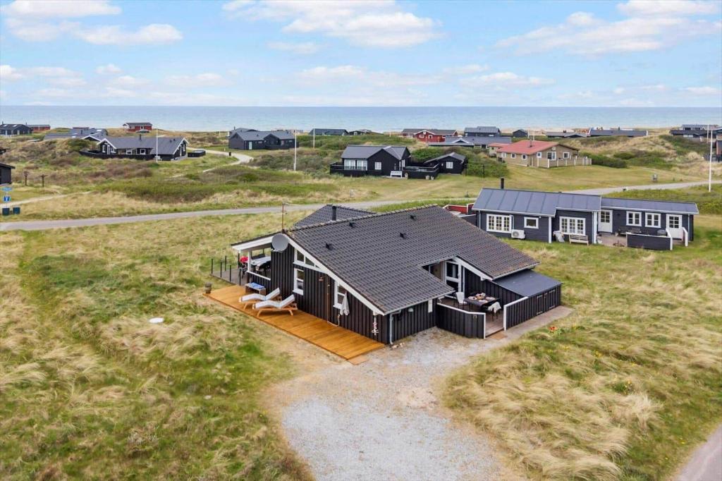 an overhead view of a house in a field at LN602-Hjorring-Harerenden-71 in Hjørring