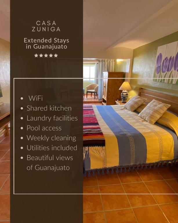 a poster of a bedroom with a bed in a room at Casa Zuniga Extended Stay in Guanajuato