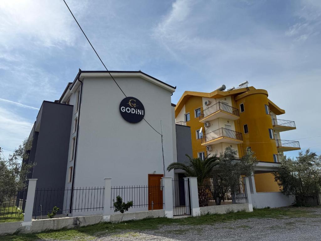 a building with a sign on the side of it at BedGodini in Golem