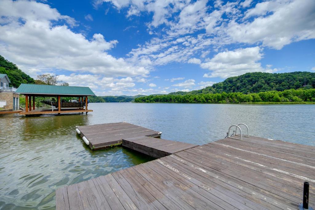 a wooden dock on a lake with a gazebo at Fire Pit & Floating Dock! Claytor Lake Hideout in Draper