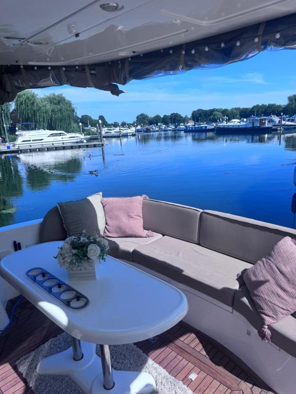 a couch and a table on the back of a boat at Midnight business in Thorpe