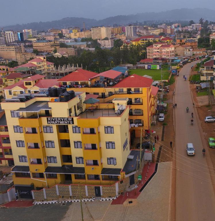 an overhead view of a city with yellow buildings at Riverview greenstar homes in Kisii