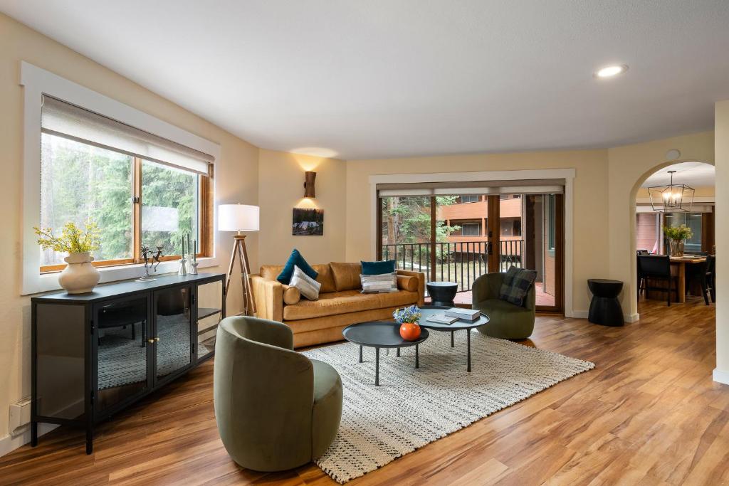 a living room with a couch and a table at Winter Park Place #1 in Winter Park