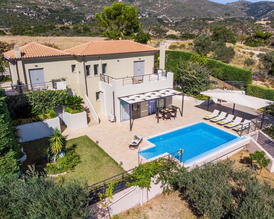 an aerial view of a house with a swimming pool at Villa Caterina in Skala