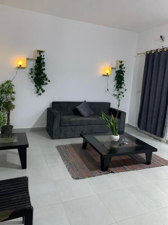 a living room with a couch and a coffee table at Voya Residence Dahab in Dahab